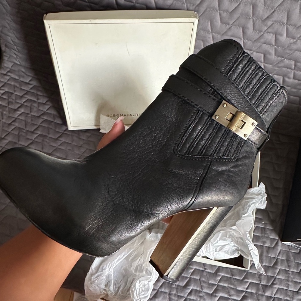 Sleek Black Leather Heeled Boots with Gold Buckle